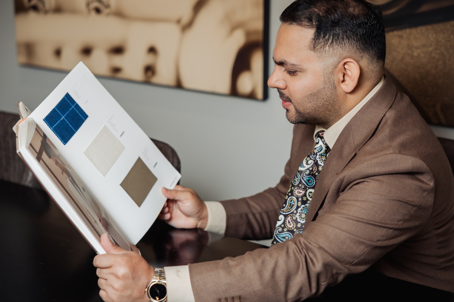Rajat Nagpal reviewing bespoke fabric swatches at the Suited Booted & Co. atelier