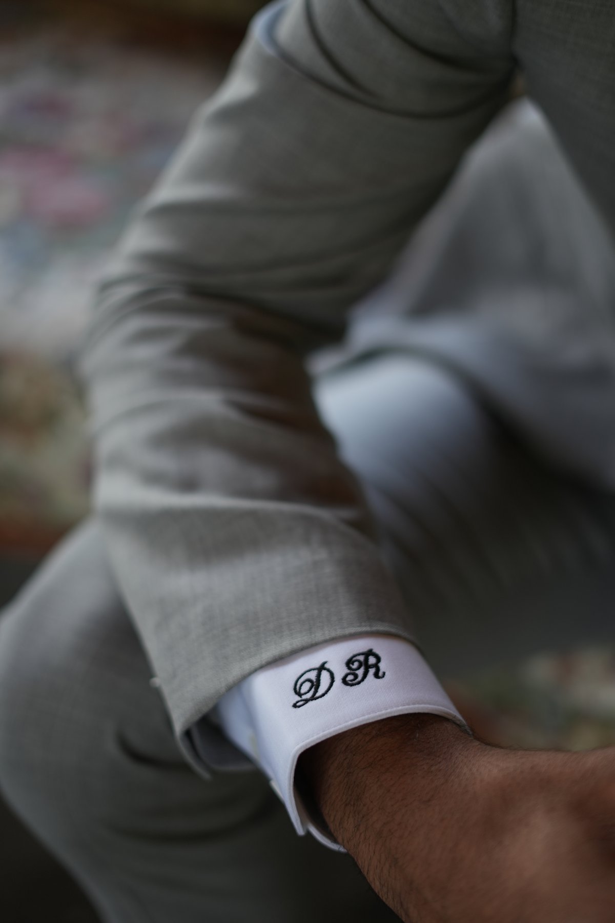 Hand-monogrammed shirt cuff on a Suited Booted & Co. bespoke commission