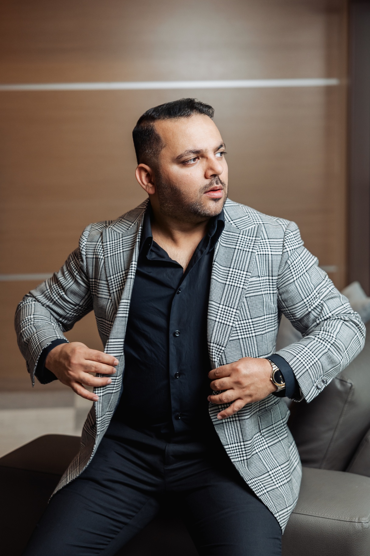 Rajat Nagpal adjusting a bespoke Prince of Wales check sport coat